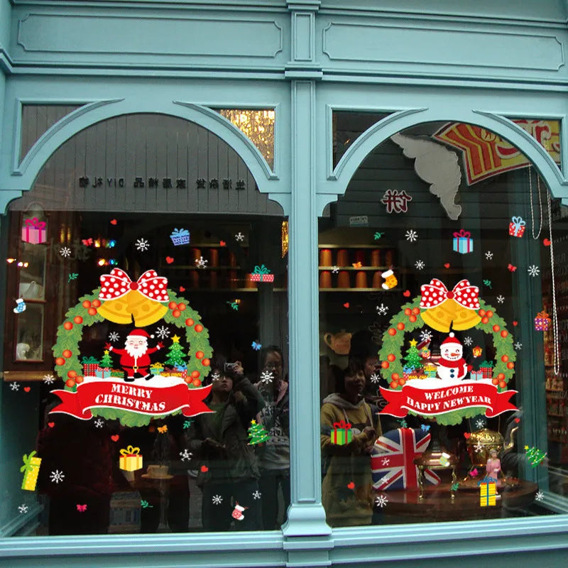 Two large colourful cartoon Christmas static cling wall stickers on a glass window