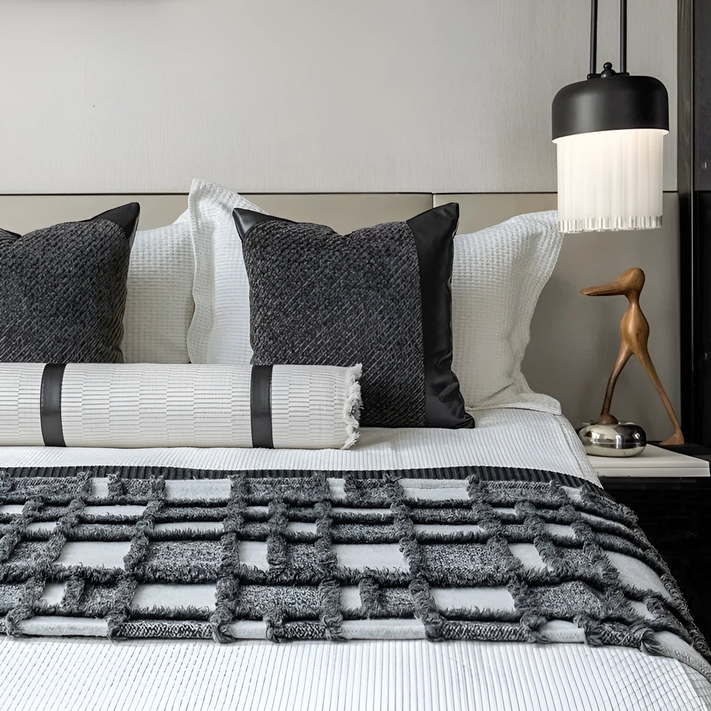 Modern minimalist bed runner set with blanket, pillowcase and leather round pillow on bed