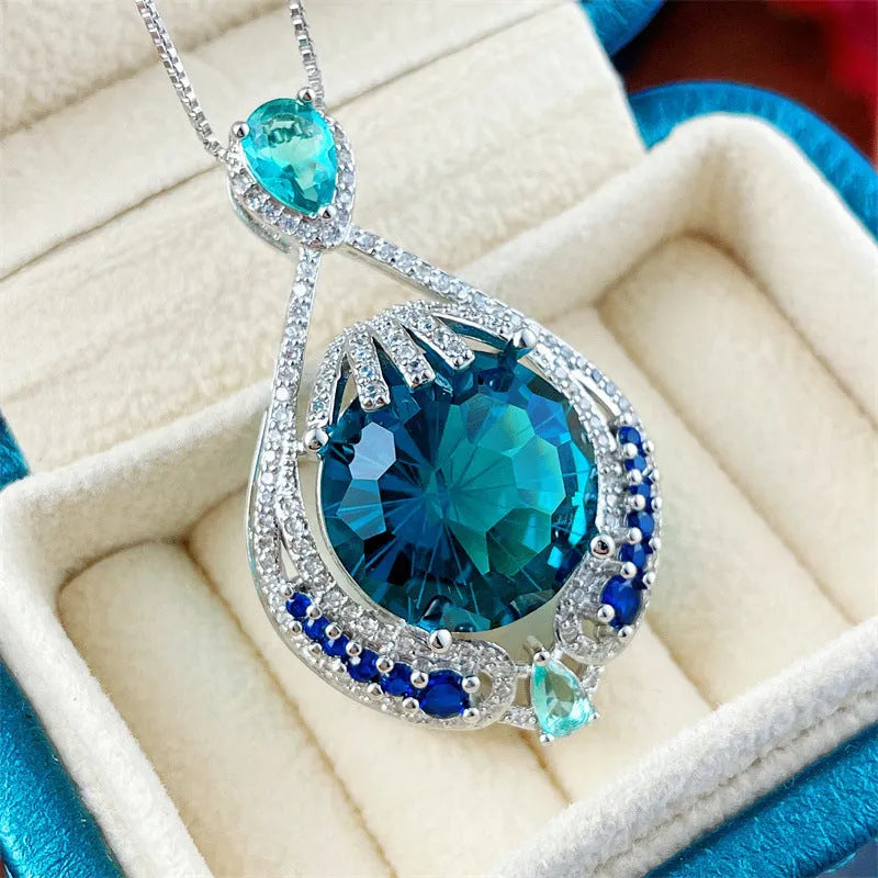 Blue fireworks cut gem geometric pendant necklace with water wave chain on woman