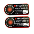 Pair of white electrostatic warning stickers for Tesla Sentry Mode, sized 11x5 cm.