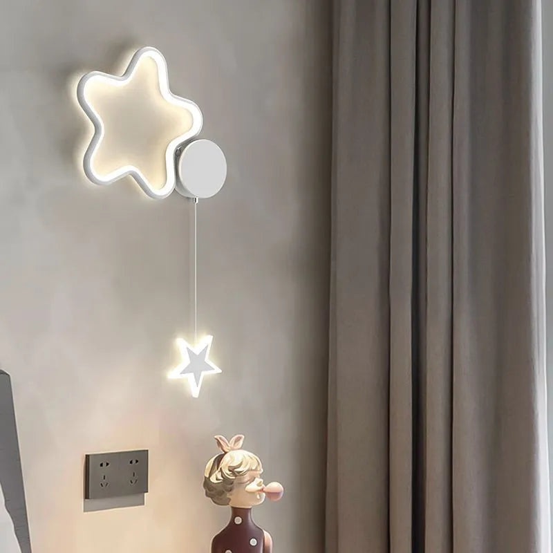 White cloud and five-pointed star children's wall mounted LED night light with three colour settings.