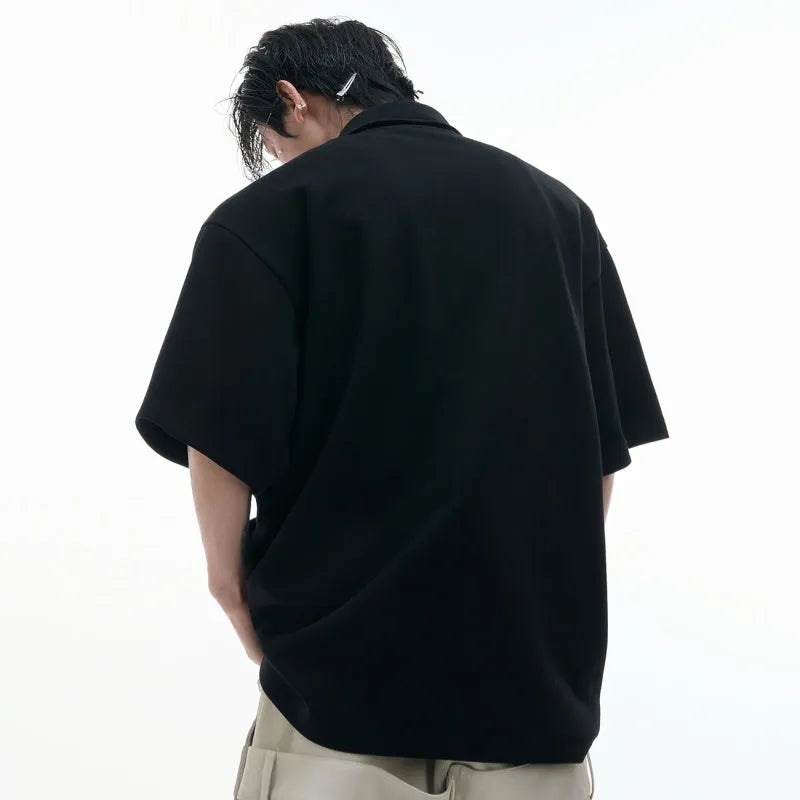 Men's deconstructed polo shirt with multi-collar design and geometric pattern details in polyester fabric