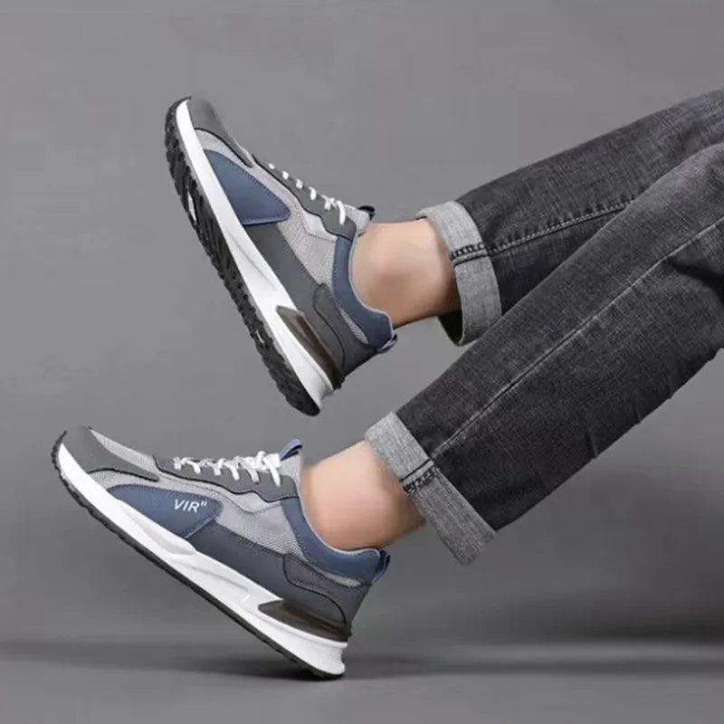 Men's colour block mesh sneakers in grey with lace-up closure and low-top design.