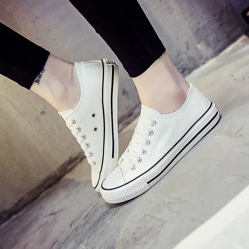 Women's solid colour canvas casual shoes in black, white black, white red, and all black.