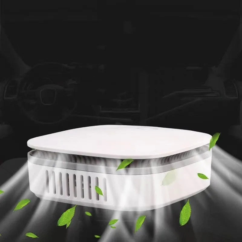 White USB-powered car air purifier with one-button control for odour removal and air disinfection.