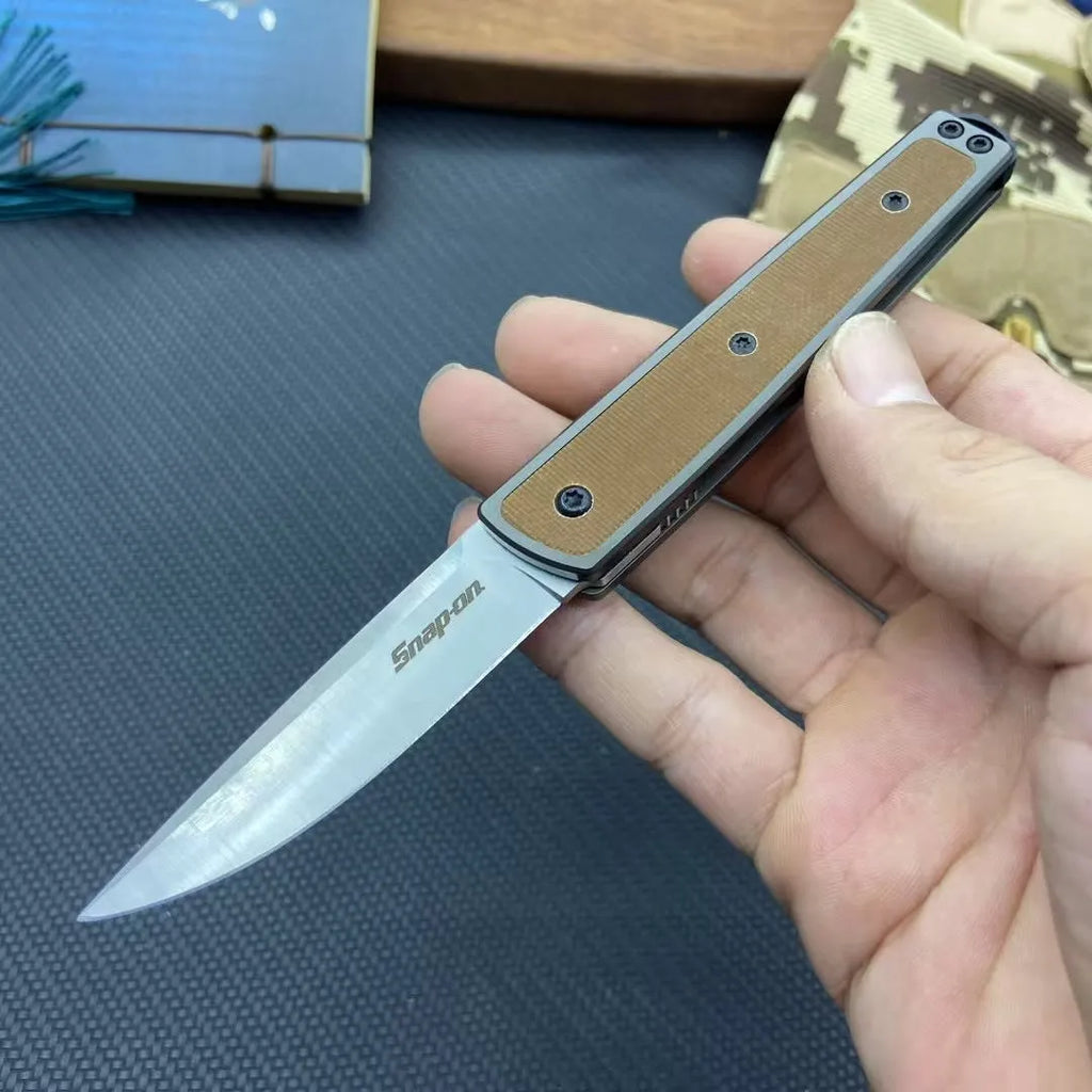 Folding fruit knife with stainless steel blade in black, brown, or red colour options