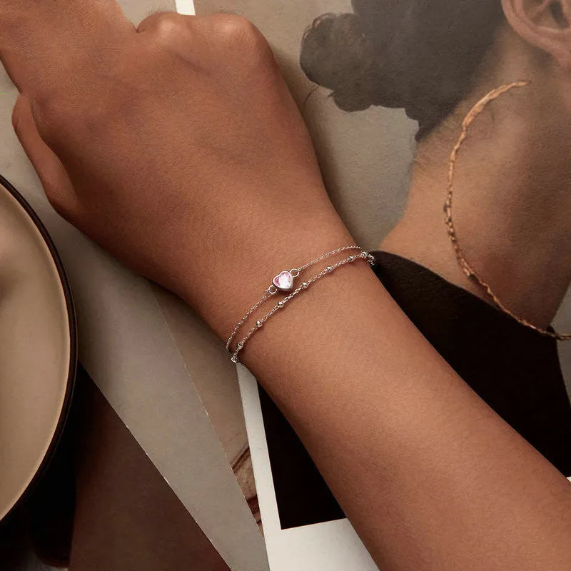 Women's 925 sterling silver bracelet with heart-shaped pendant on adjustable chain