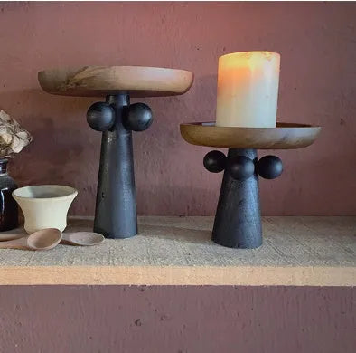 Nordic style high-legged round wooden tray on a table.