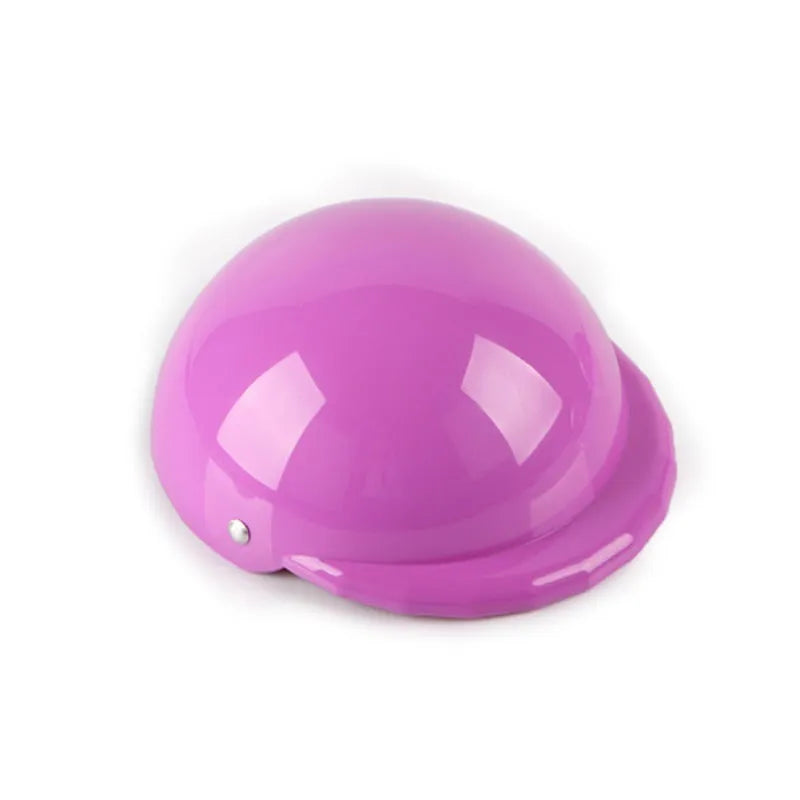 A pink plastic dog helmet cap showing its rigid shape and solid colour, sized for a small dog.