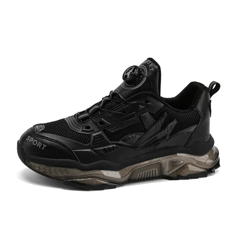 Men's black casual sneakers with rotating button closure and mesh upper on rubber sole.