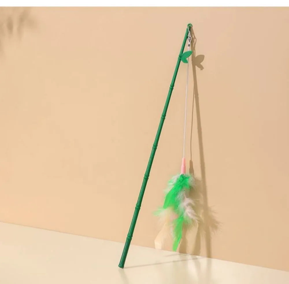 Green interactive cat feather wand toy with bell attachment and a comfortable grip handle.