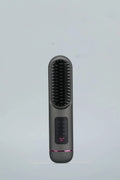 White, dark blue, and grey portable rechargeable negative ion hair comb for static control and straightening.