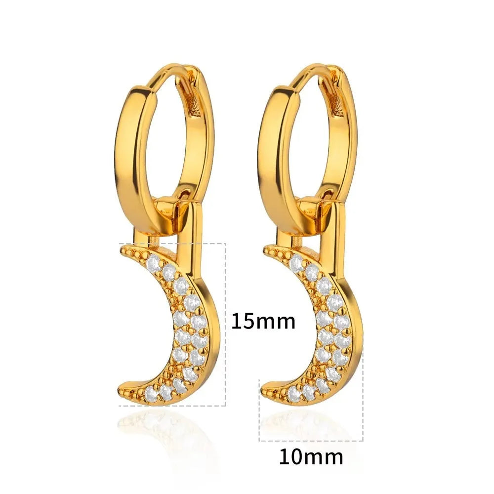 A pair of women's geometric butterfly earrings made from copper with heart, bow, and star shapes in a gold colour finish.