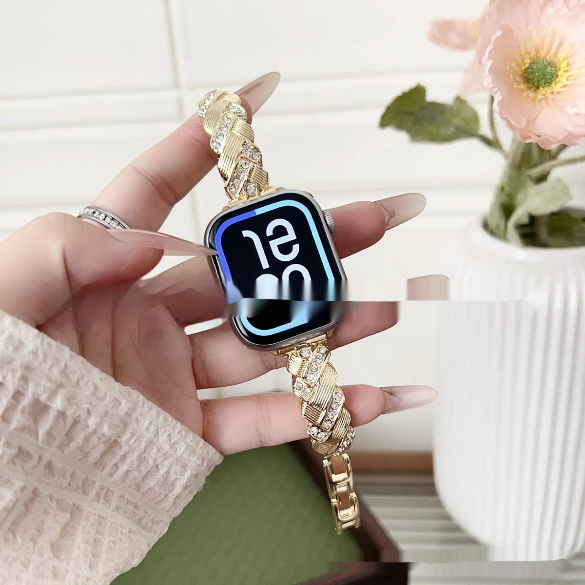 Zinc alloy twist-design Apple Watch band in silver, rose gold, gold, black, and starlight colours on a grey background.