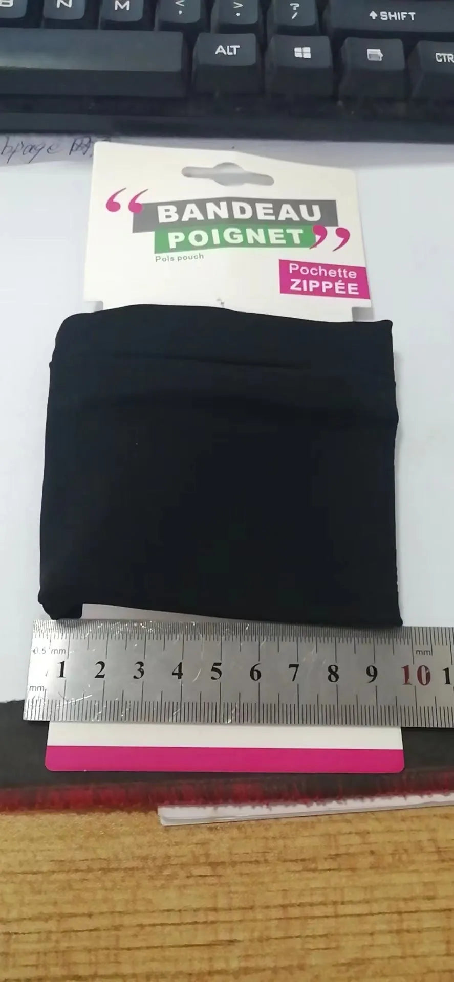 Black wrist bag armband sleeve for mobile phone, shown with dimensions 10cm by 10.5cm.