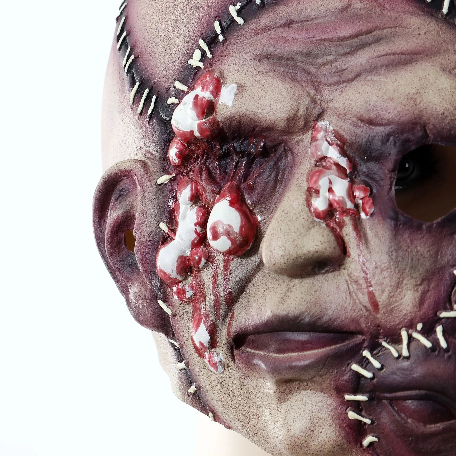 Three-sided grimace horror mask showing latex texture and comprehensive facial coverage for Halloween costumes