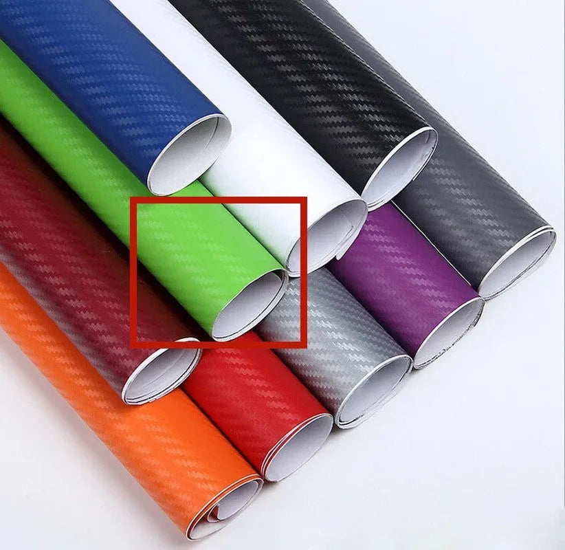 Roll of 3D carbon fibre car sticker showing black, silver, blue, and yellow colour options