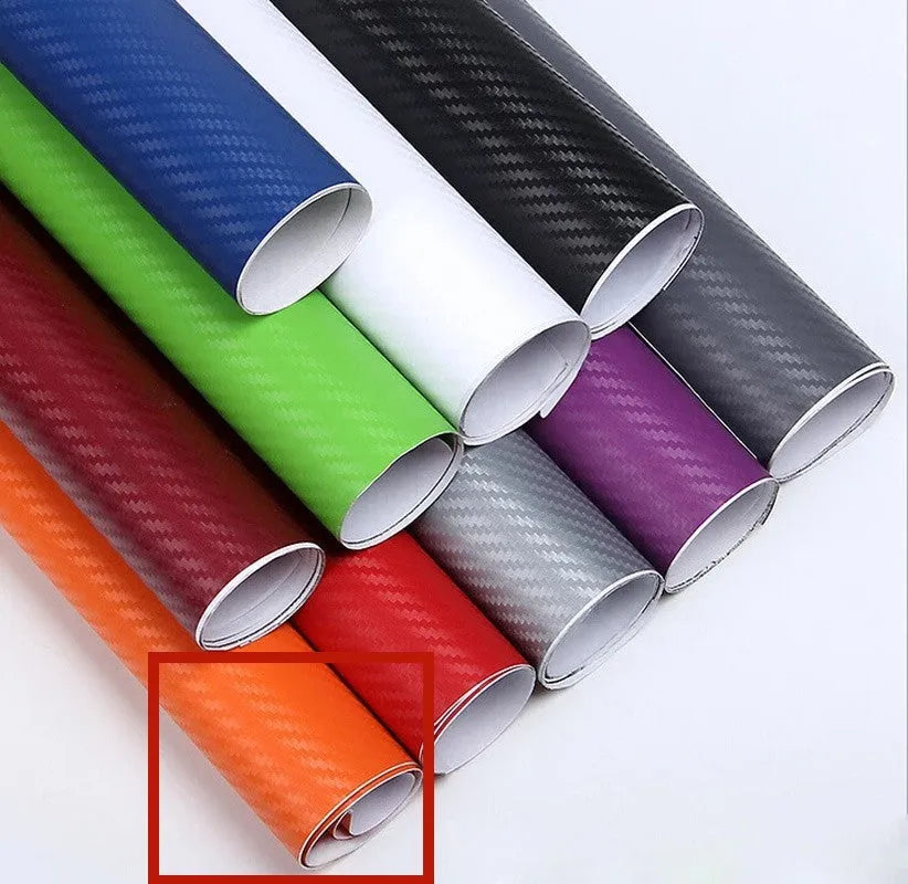 Roll of 3D carbon fibre car sticker showing black, silver, blue, and yellow colour options