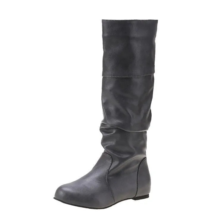 Women's black flat-heel slip-on ankle boots with round toe and high shaft on a rubber sole.