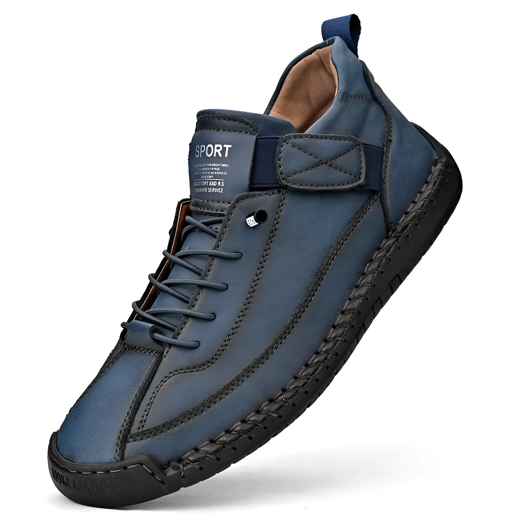 Men's mid-calf black Martin boot with stitching detail and elastic side band, flat rubber sole.
