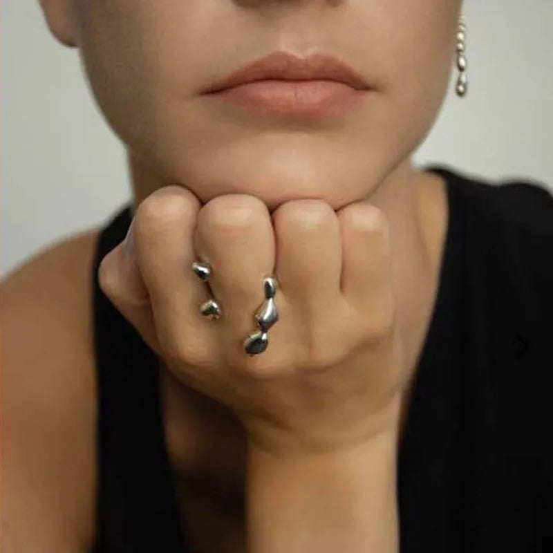 Brass opening ring with spherical elements in gold or silver finish
