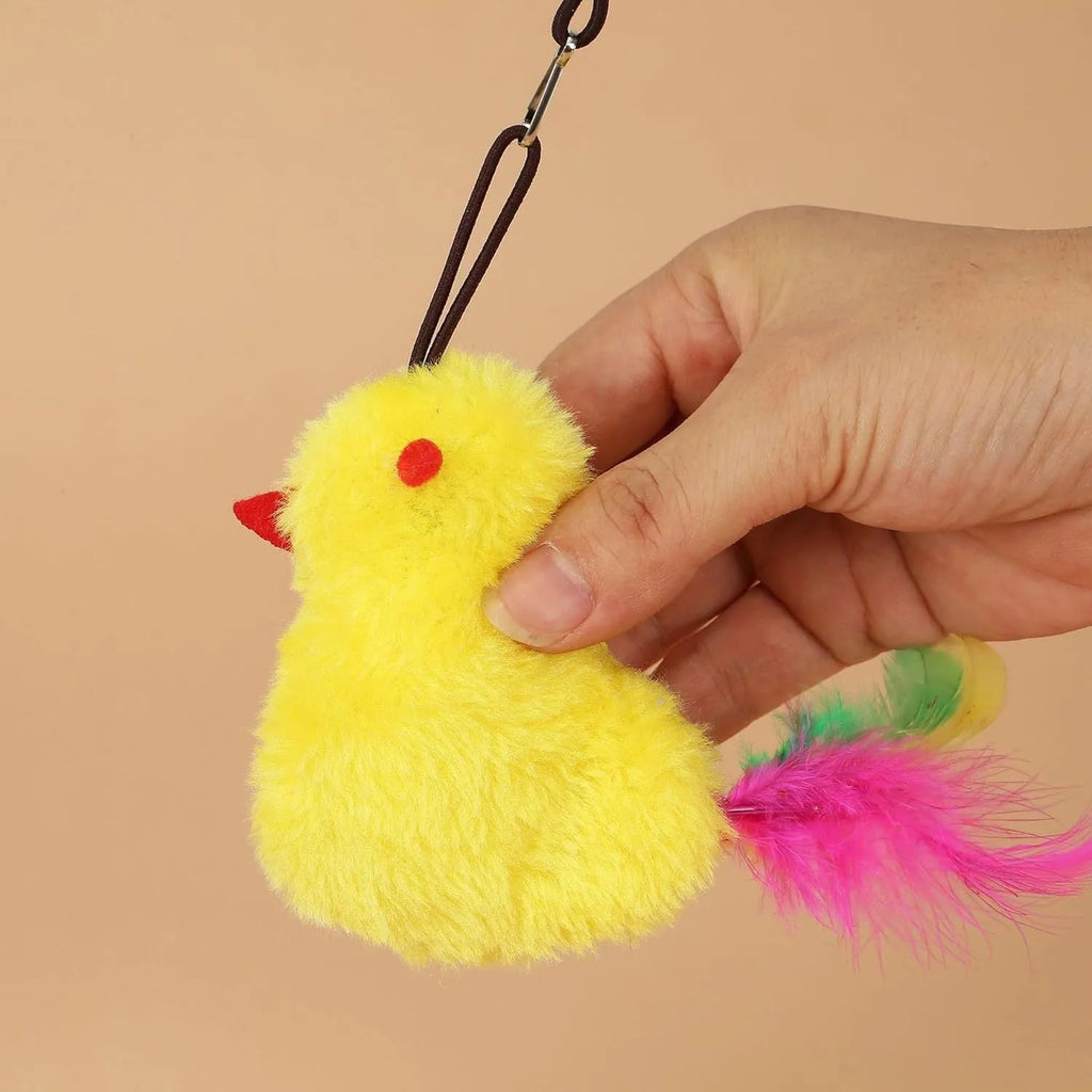 Grey and yellow retractable cat teaser toy hanging on door frame with treat bulb and dangling mouse