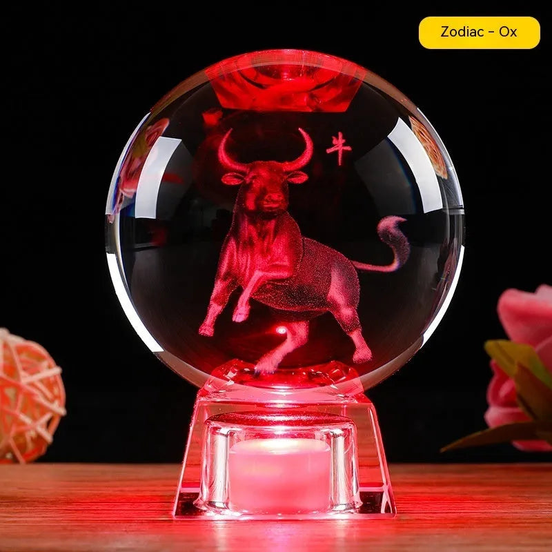 White crystal zodiac ornament with electronic luminous base showing Chinese animal design