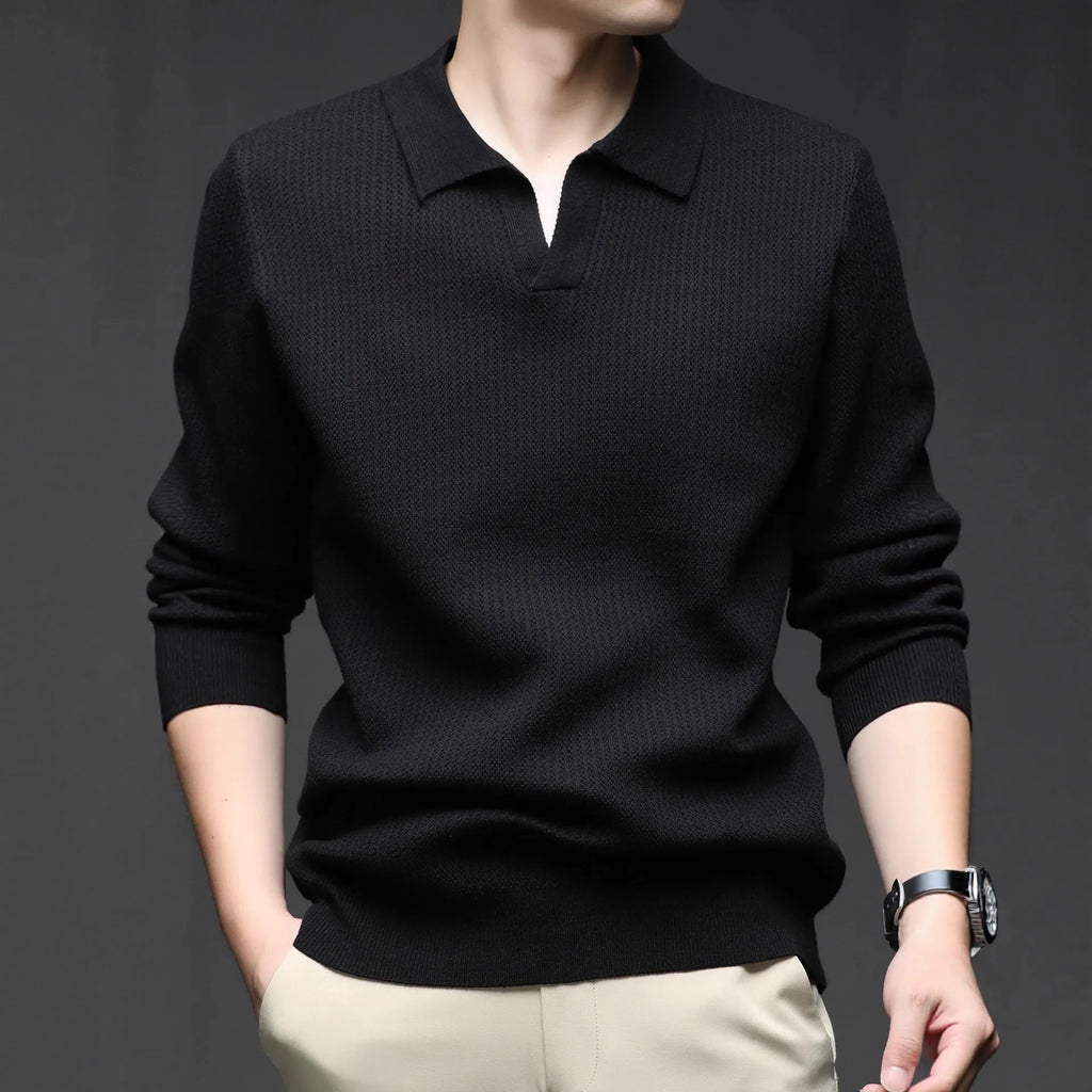Men's loose green pullover sweater for casual autumn wear on a hanger