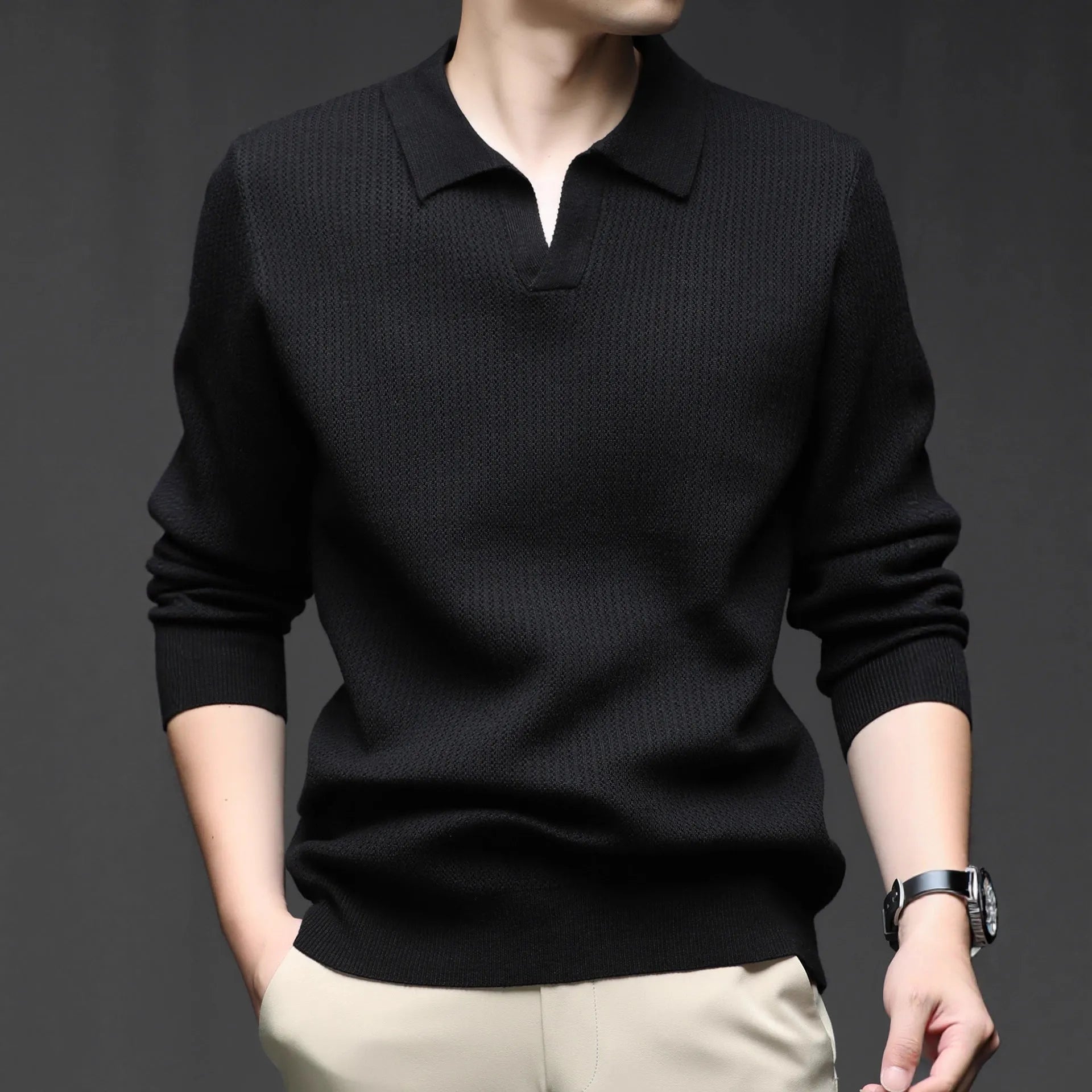 Men's loose green pullover sweater for casual autumn wear on a hanger