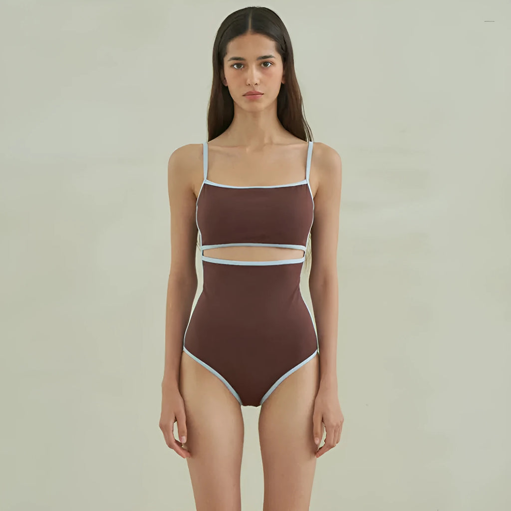Brown women's triangle one-piece swimsuit on a hanger.