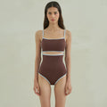 Brown women's triangle one-piece swimsuit on a hanger.
