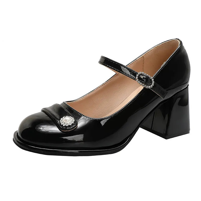 Women's black patent leather chunky heel shoes with round toe and buckle fastening