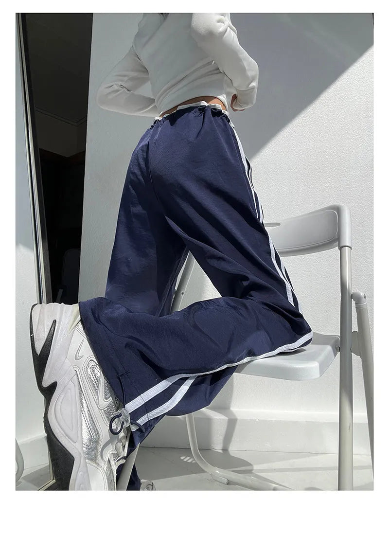 Women's slim drape trousers with contrast ribbon parallel bars detailing and loose straight leg cut