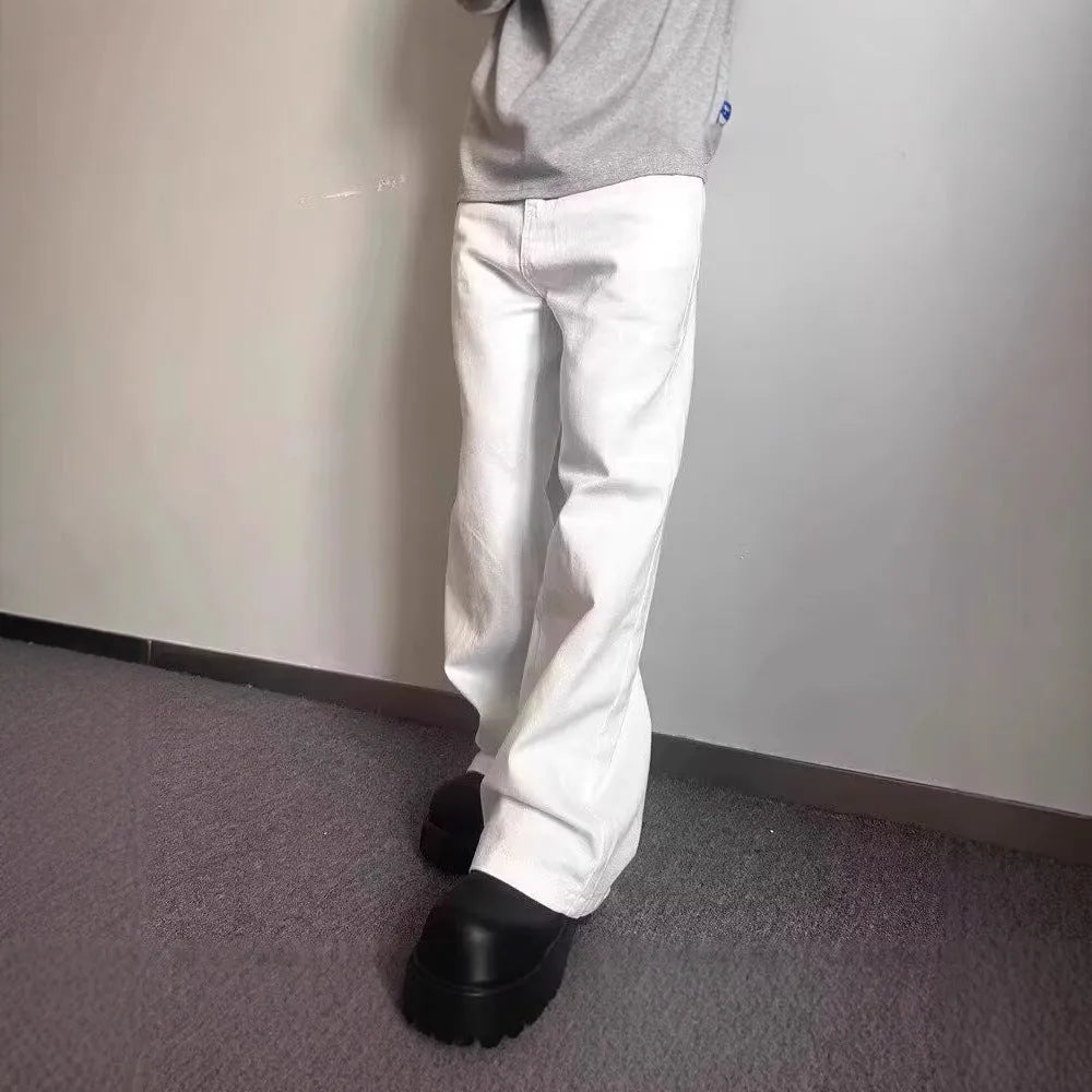Men's white straight-leg denim jeans on a neutral background, showing mid waist and loose fit.