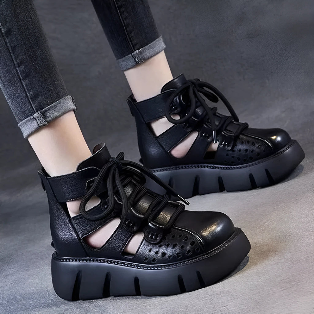 Women's black platform sandals with hollow hole design and fish-mouth toe, made from soft cowhide leather.