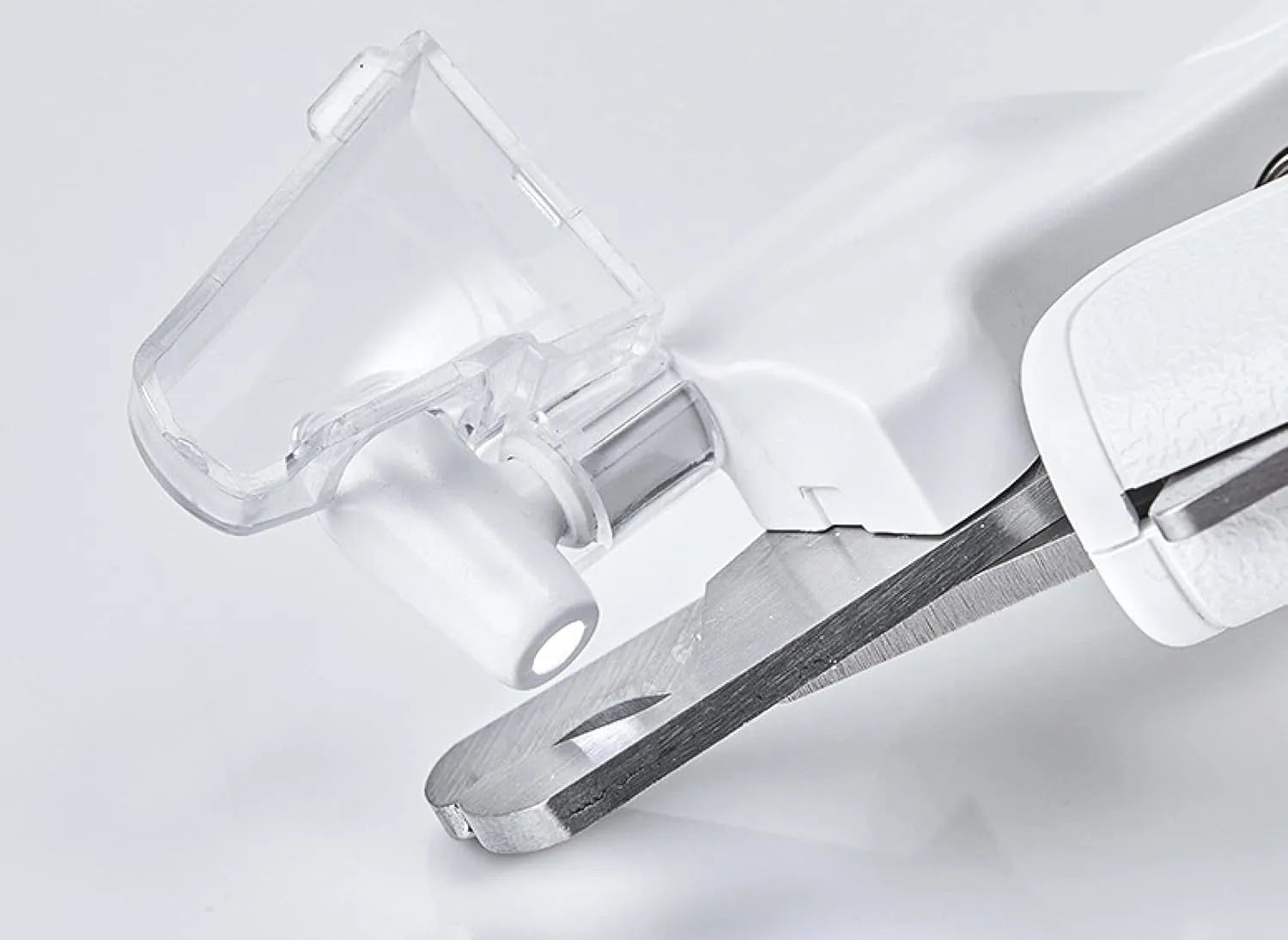 White LED pet nail clipper with transparent anti-splash guard open, showing triangular stainless steel blade