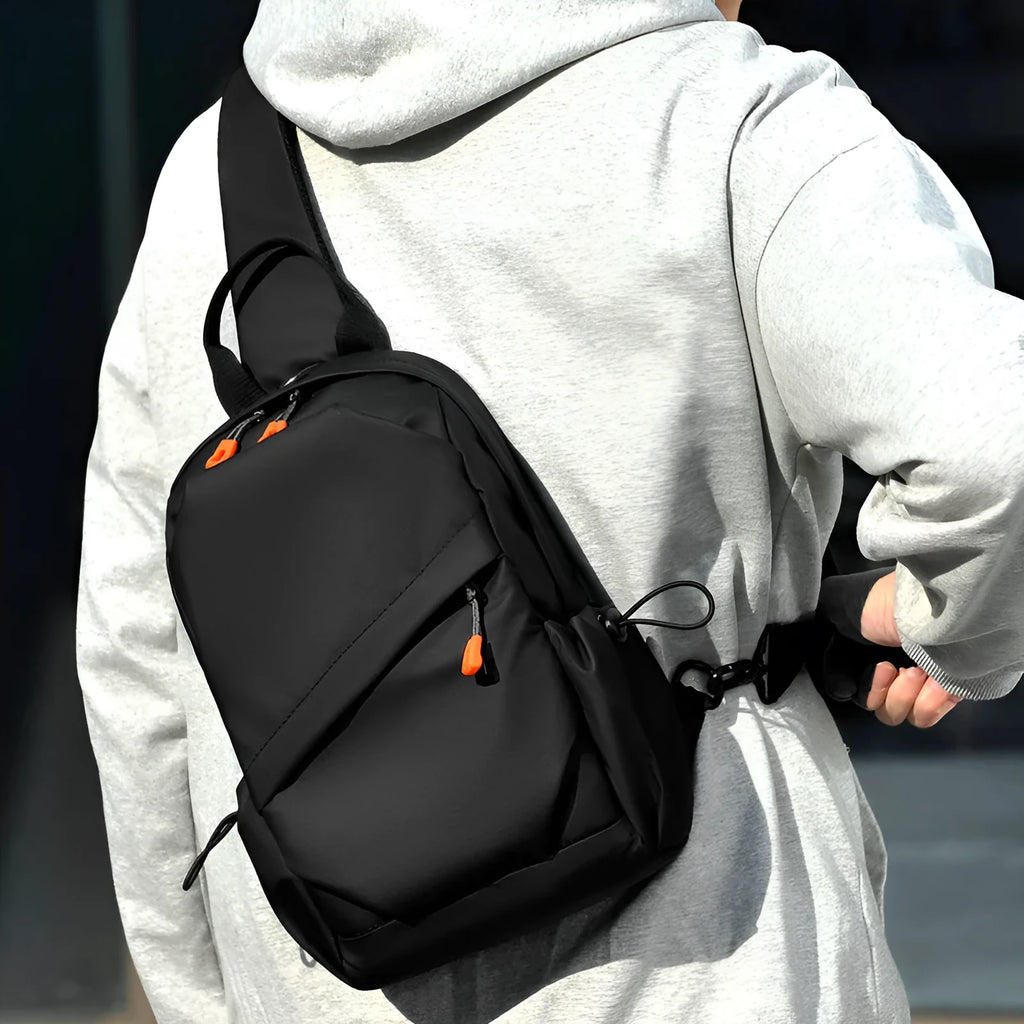Men's black casual crossbody bag with an adjustable shoulder strap made from waterproof polyester.