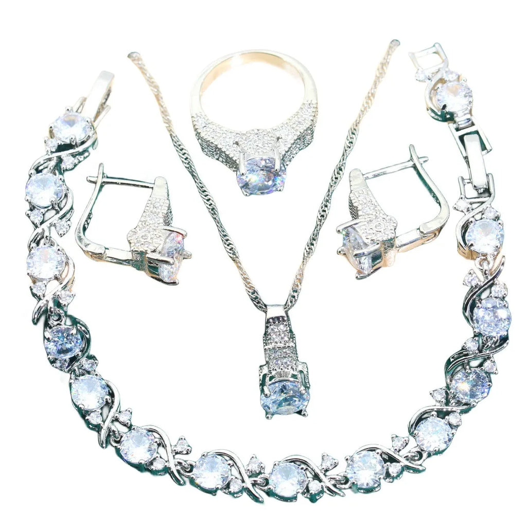 Bridal four-piece zircon jewellery set showing necklace, bracelet, earrings, and ring in alloy with water wave chain.