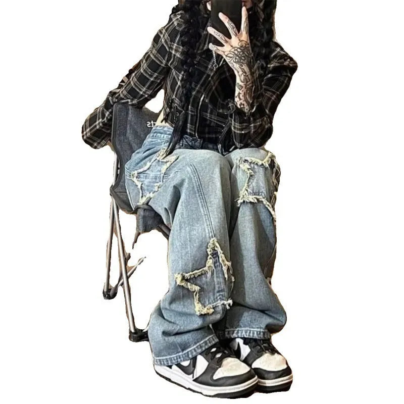 Blue women's high waist wide-leg denim jeans on a hanger, showing straight leg cut.