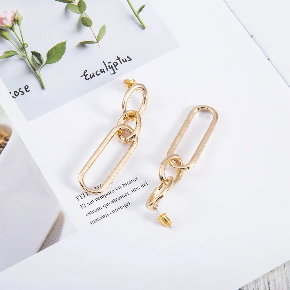 Geometric sterling silver needle hoop earrings with ring and line design elements