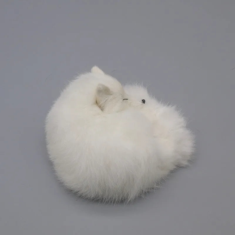 Artificial white fox fur handmade car decoration on a dashboard