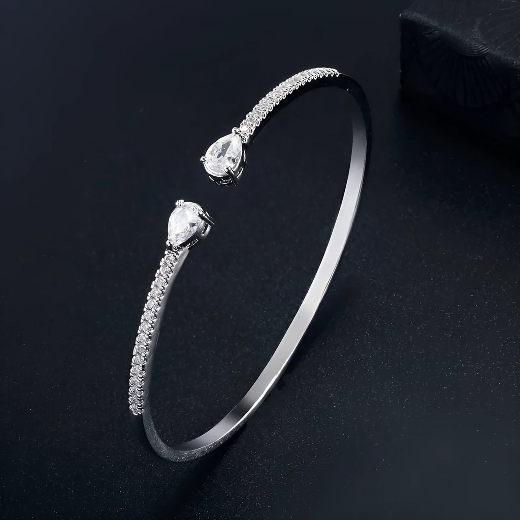 Copper bracelet with zircon inlay in simple design available in white or blue colour options