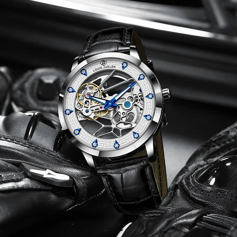 Men's silver mechanical watch with white dial, blue hands, black leather strap, and stainless steel buckle