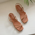 Women's flat open-toed Roman sandals with square toe and microfiber straps in beige, green and white.