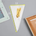 Clear triangle-shaped plastic packaging bag with a twisted wire tie closure.