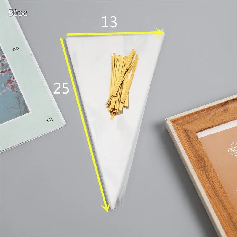 Clear triangle-shaped plastic packaging bag with a twisted wire tie closure.