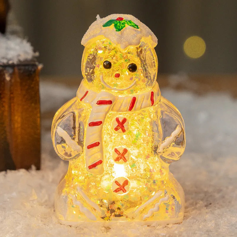 Set of four glowing plastic Christmas ornaments: gingerbread men and snowmen with red, white, and transparent scarves.
