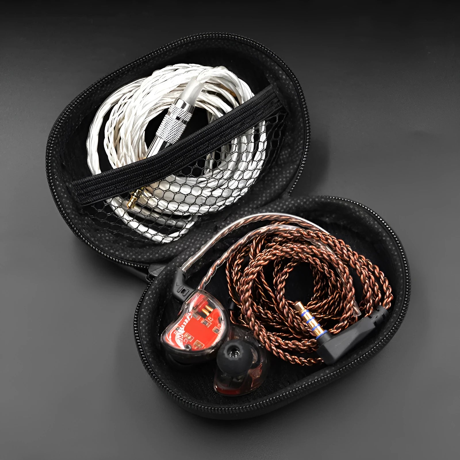 Black oval leather earphone storage case for EDX PRO and ZEX PRO models.