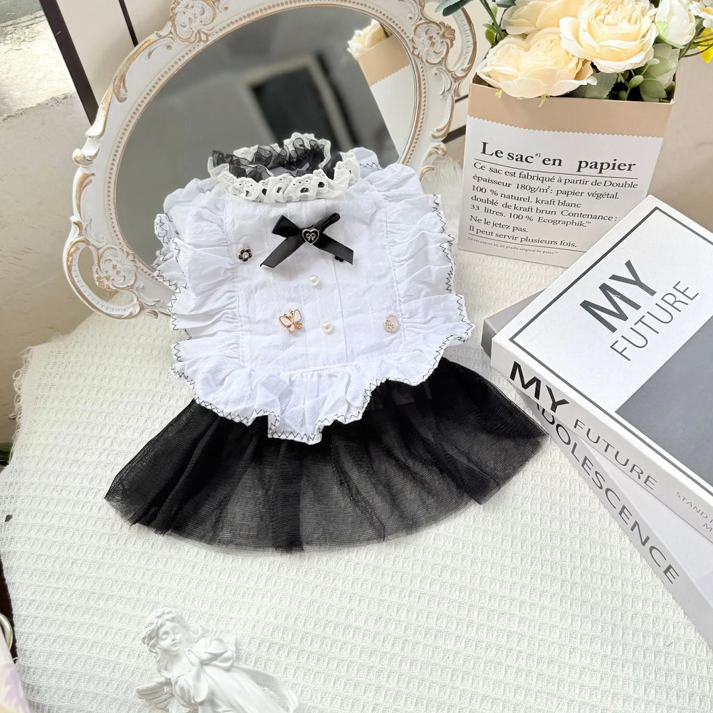 White polyester dog dress with a layered gauze skirt, shown on a small dog.