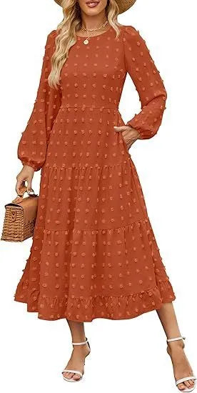 Women's long sleeve dress with ruffled sleeves and high waist in a solid colour.